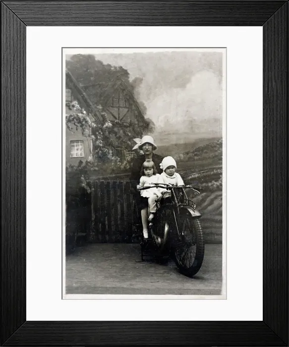 Framed Print : Mother and her two young children - studio photo on bike Framed Print : Mother and her two young children - studio photo on bike