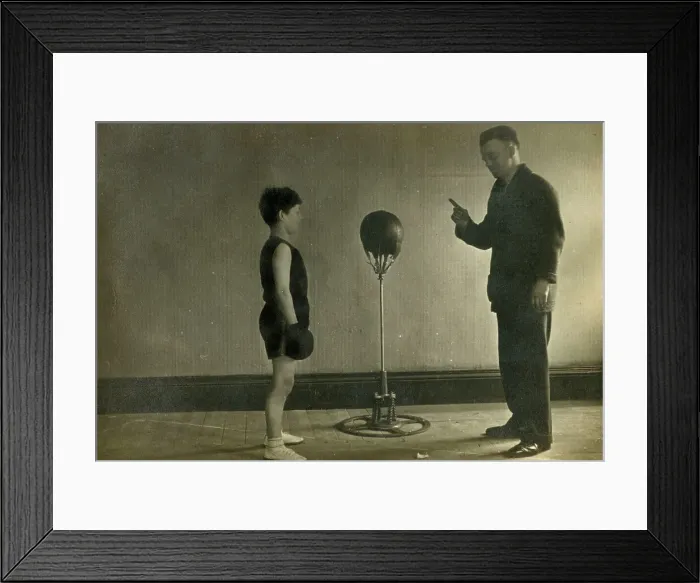 Framed Print : Young Boxer receiving instruction from his Trainer in a gym Framed Print : Young Boxer receiving instruction from his Trainer in a gym