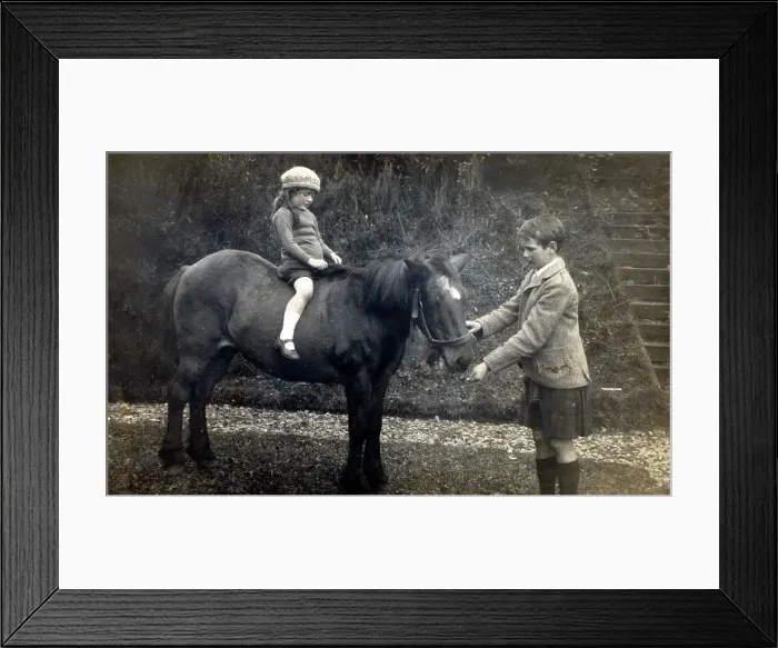 Framed Print : A young Scottish girl taken out for a ride on a pony Framed Print : A young Scottish girl taken out for a ride on a pony