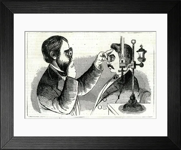 Framed Print : Optician examining a patient's eyes Framed Print : Optician examining a patient's eyes