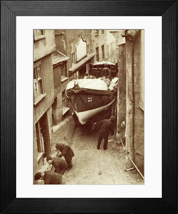 Framed Print : Hauling the lifeboat through a narrow street Framed Print : Hauling the lifeboat through a narrow street