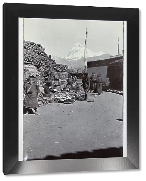 Scene at Phari bazaar, in Yadong County, on the Tibet border, with Mount Jomolhari or Chomolhari (2400 feet) in the distance, from a fascinating album which reveals new details on a little-known campaign in which a British military force brushed