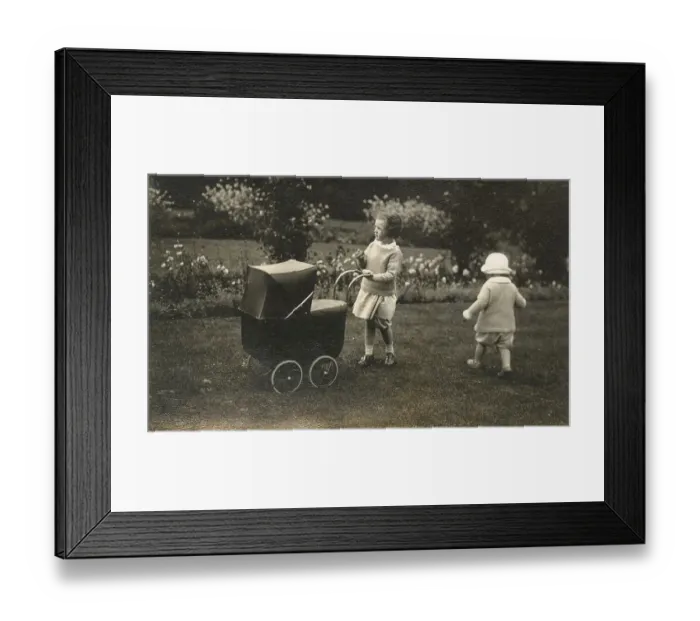 Framed Print : Two young siblings playing with a beautiful toy pram Framed Print : Two young siblings playing with a beautiful toy pram