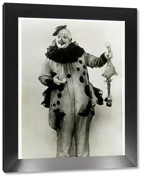 Clown Uncle Jolliboy - holding up a fake chicken