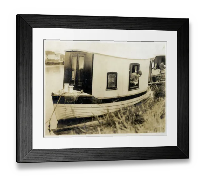 Framed Print : Cute, miniature Houseboat and occupant Framed Print : Cute, miniature Houseboat and occupant