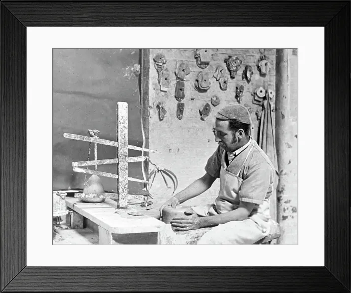 Framed Print : Throwing a pot on a wheel in a pottery factory Framed Print : Throwing a pot on a wheel in a pottery factory