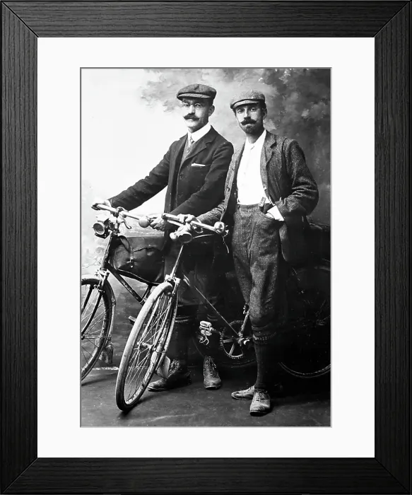 Framed Print : Portrait studio photo of cyclists, early 1900s Framed Print : Portrait studio photo of cyclists, early 1900s