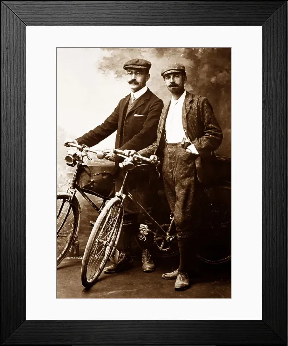 Framed Print : Portrait studio photo of cyclists, early 1900s Framed Print : Portrait studio photo of cyclists, early 1900s