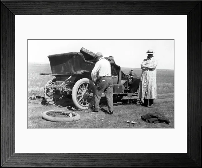 Framed Print : Fixing a puncture, early 1900s Framed Print : Fixing a puncture, early 1900s