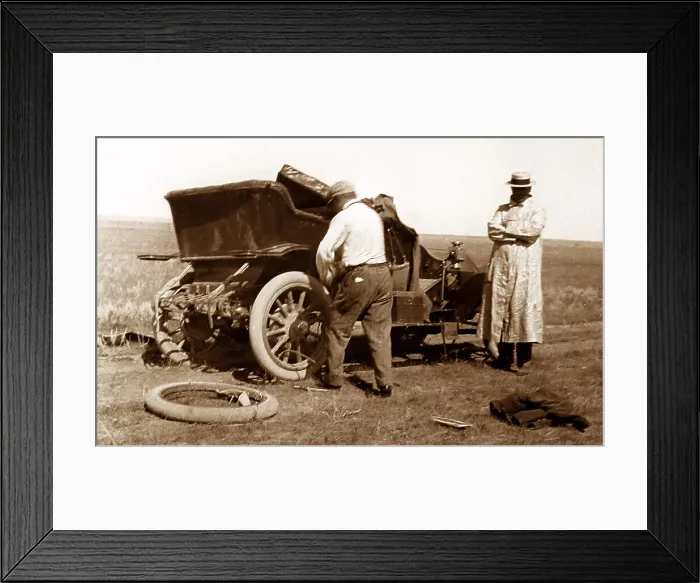 Framed Print : Fixing a puncture, early 1900s Framed Print : Fixing a puncture, early 1900s