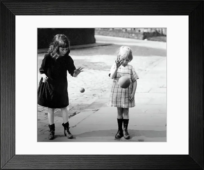 Framed Print : Children bouncing balls, early 1900s Framed Print : Children bouncing balls, early 1900s