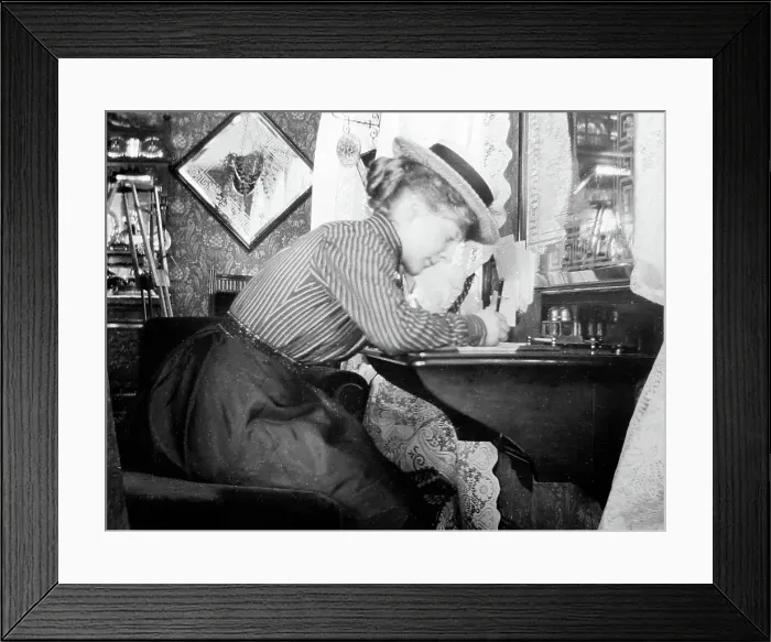 Framed Print : Lady writing at her desk, early 1900s Framed Print : Lady writing at her desk, early 1900s