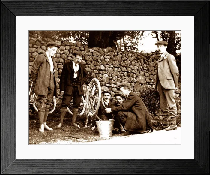 Framed Print : Mending a puncture, early cycling Framed Print : Mending a puncture, early cycling