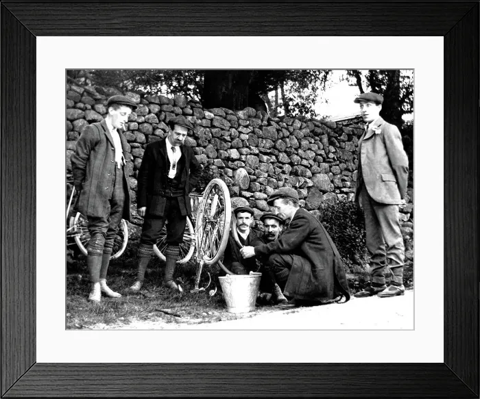 Framed Print : Cycling mending a puncture early 1900s Framed Print : Cycling mending a puncture early 1900s
