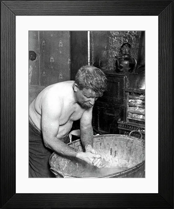 Framed Print : Coal miner washing at home