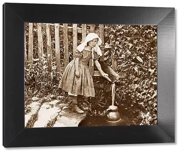 Girl fetching water from the well