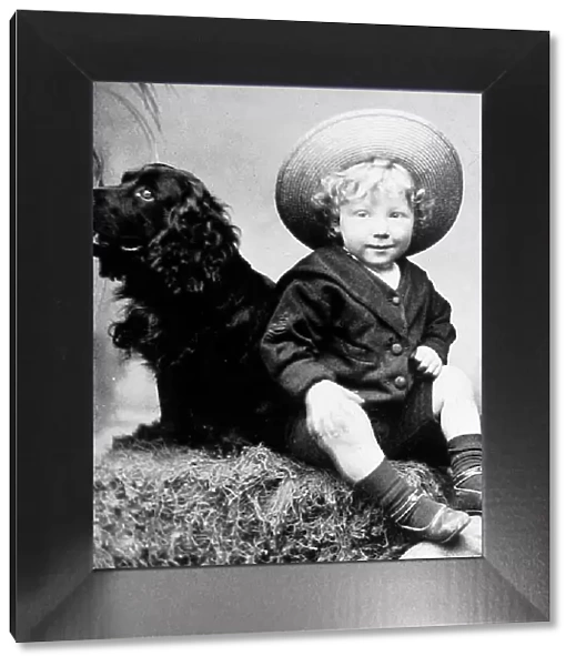 Boy and his dog studio portrait early 1900s