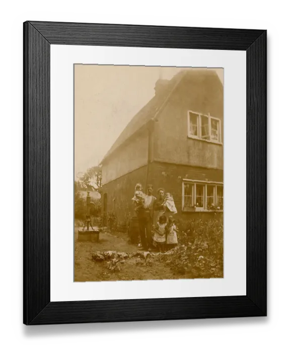 Framed Print : Mother, Father and children pose in their kitchen garden Framed Print : Mother, Father and children pose in their kitchen garden