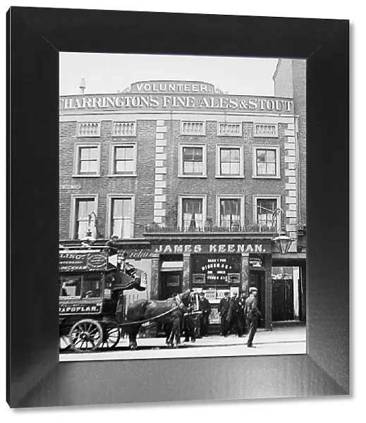 The Volunteer pub, Poplar, London and a Tilling horse bus