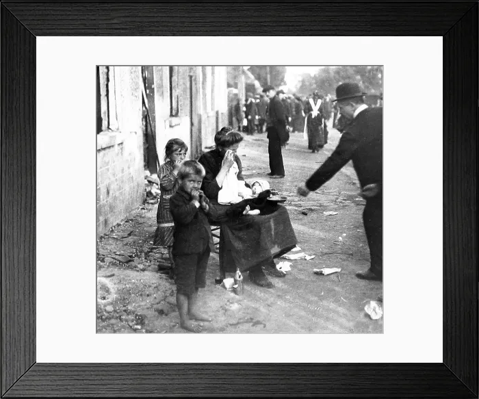 Framed Print : Belgian family begging in front of their burnt-out Framed Print : Belgian family begging in front of their burnt-out