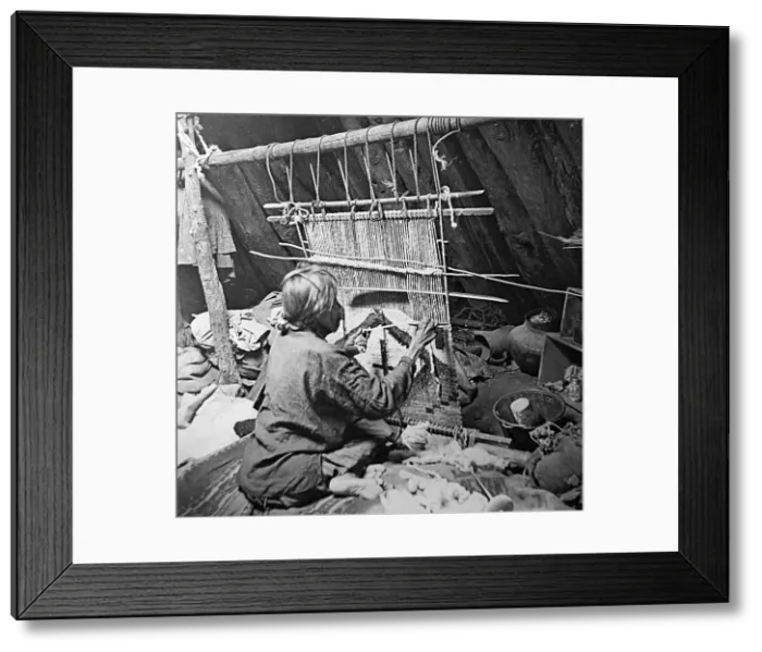 Framed Print : A Navajo Indian making a rug - early 1900s Framed Print : A Navajo Indian making a rug - early 1900s