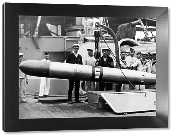 Royal Navy sailors with a torpedo