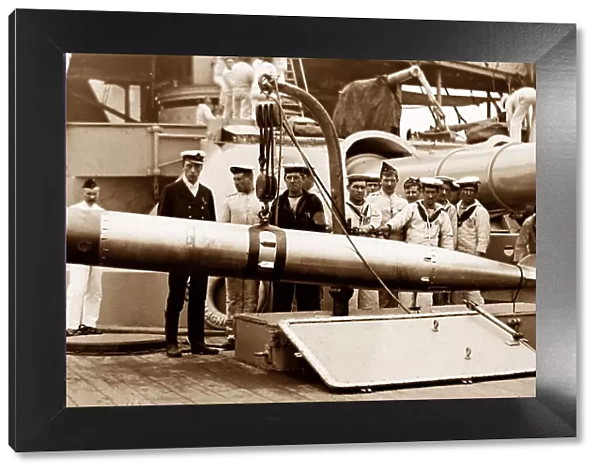 Royal Navy sailors with a torpedo - probably WW1