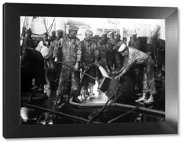 British Navy sailors tarring rope