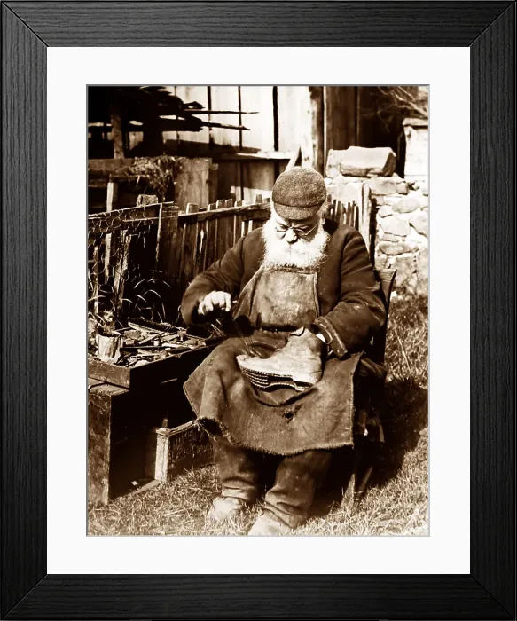 Framed Print : Cobbler mending shoes