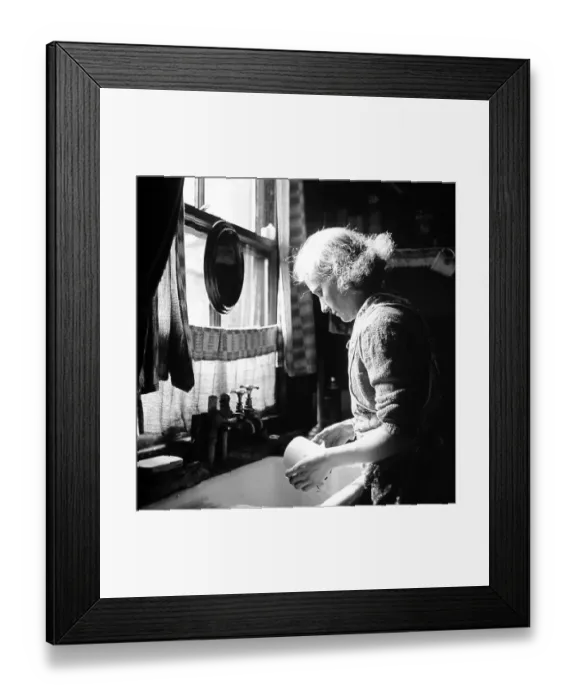 Framed Print : Woman at kitchen sink washing dishes, 1920s 0r 1930s Framed Print : Woman at kitchen sink washing dishes, 1920s 0r 1930s