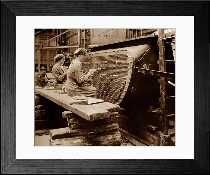 Framed Print : WW1 Women working on a condenser tube in a factory Framed Print : WW1 Women working on a condenser tube in a factory