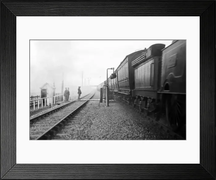 Framed Print : Steam train picking up mail bag, early 1900s Framed Print : Steam train picking up mail bag, early 1900s