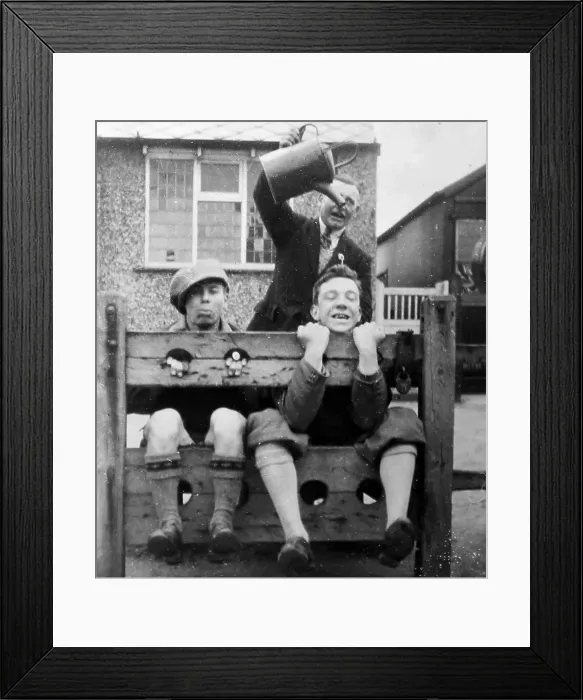 Framed Print : In the stocks at Seamer in the 1920s Framed Print : In the stocks at Seamer in the 1920s