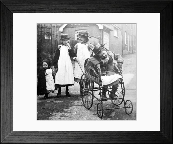 Framed Print : Disabled child in a wheelchair Framed Print : Disabled child in a wheelchair