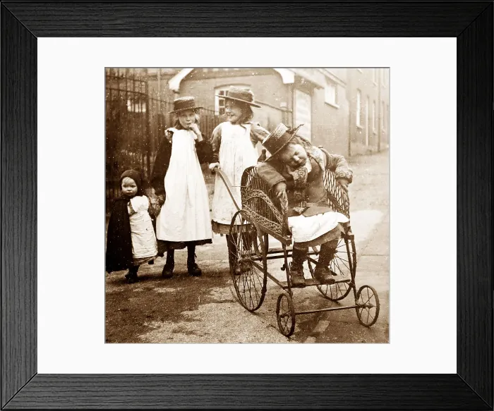 Framed Print : Disabled child in a wheelchair Framed Print : Disabled child in a wheelchair