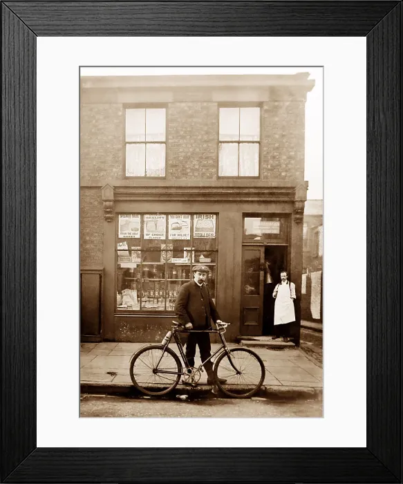 Framed Print : Grocery shop and cyclist in Rawtenstall, early 1900s Framed Print : Grocery shop and cyclist in Rawtenstall, early 1900s