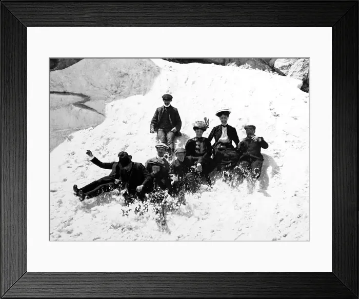 Framed Print : Family on holiday glissading in the snow, Victorian period Framed Print : Family on holiday glissading in the snow, Victorian period