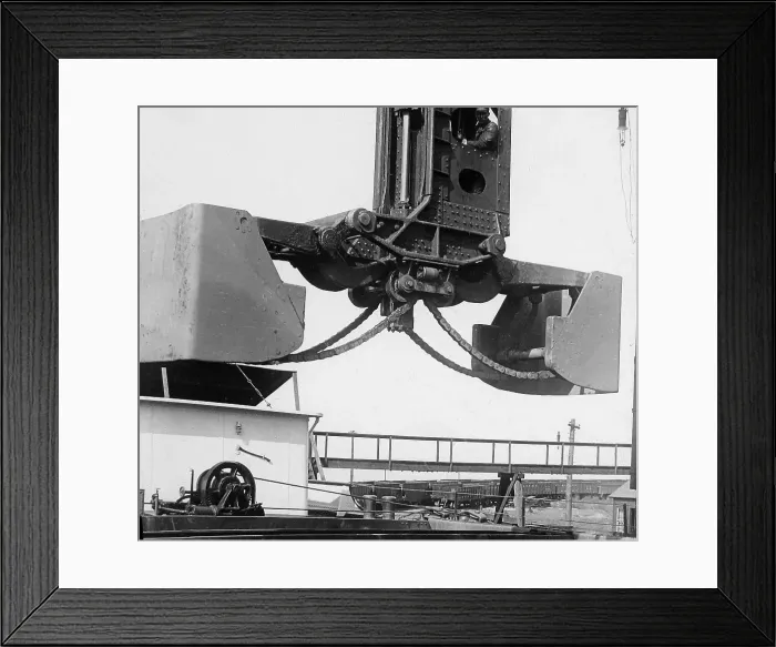 Framed Print : A Hughlett clam-shell hoist unloading a ship's Framed Print : A Hughlett clam-shell hoist unloading a ship's
