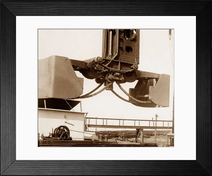 Framed Print : A Hughlett clam-shell hoist unloading a ship's Framed Print : A Hughlett clam-shell hoist unloading a ship's