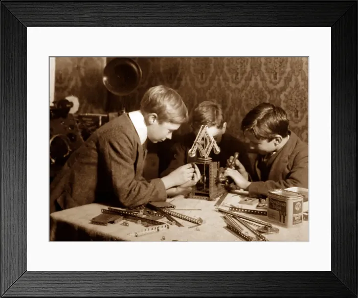 Framed Print : Boys playing with Meccano, early 1900s Framed Print : Boys playing with Meccano, early 1900s