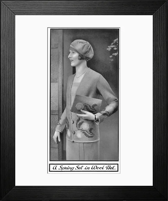 Framed Print : Model wearing an embroidered jacket and carrying a matching embroidered pochette, made of perforated wool net fabric. Date: 1920s Framed Print : Model wearing an embroidered jacket and carrying a matching embroidered pochette, made of perforated wool net fabric. Date: 1920s