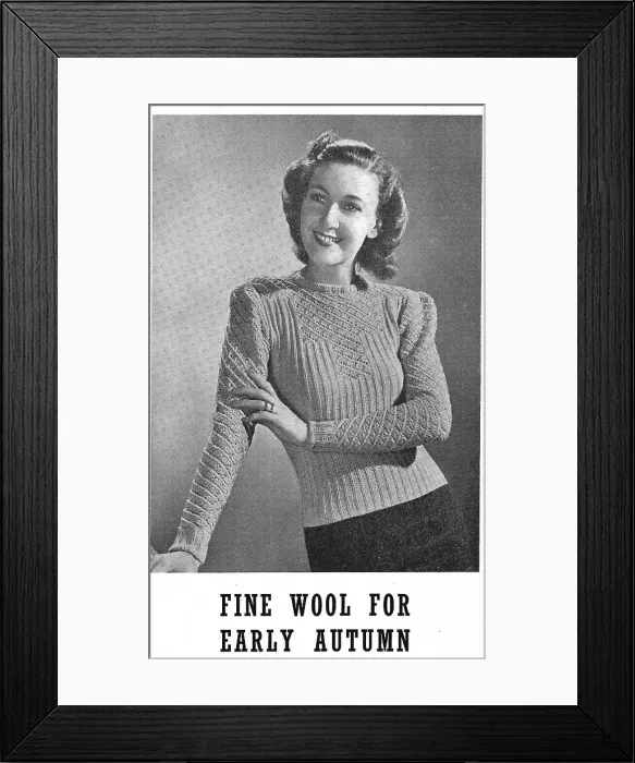 Framed Print : Model wearing a knitted sweater in a ribbed and lace pattern. Date: 1940 Framed Print : Model wearing a knitted sweater in a ribbed and lace pattern. Date: 1940