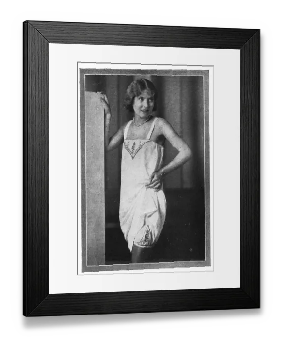 Framed Print : Model wearing embroidered chemise over embroidered long knickers and stockings Date: 1920s Framed Print : Model wearing embroidered chemise over embroidered long knickers and stockings Date: 1920s