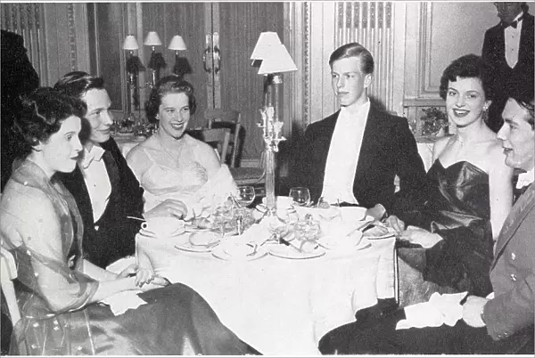 A group at the Trinity College Beagles Ball, held at the Hyde Park Hotel in London in the spring of 1956. From left: Miss Jennifer Bott, Mr Robert Philipson-Stowe, Miss Dillys Le Fleming, Mr. A. W. Wiggin, Miss Belinda Stobart and Mr. R. D