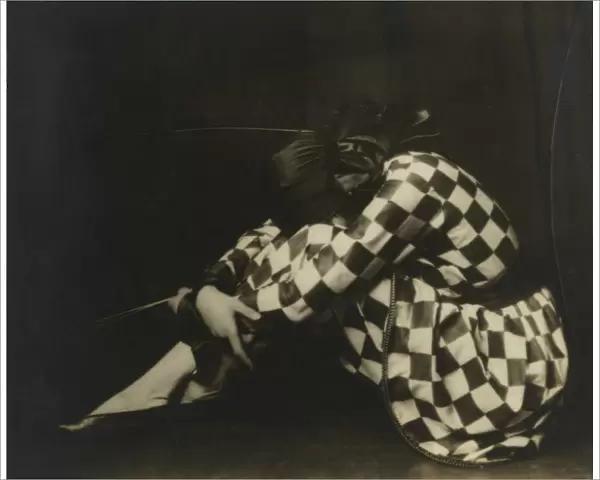 Yevonde Cumbers Middleton (1893-1975), also known professionally as Madame Yevonde, posing as Harlequin in a 1923 self-portrait. Date: 1923