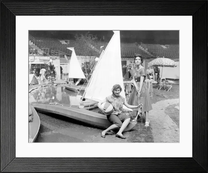 Framed Print : Models displaying a sailing dinghy