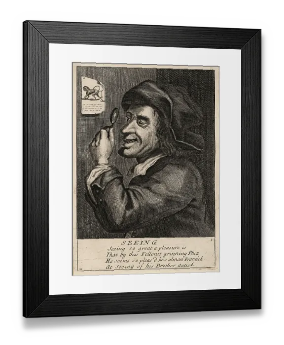 Framed Print : 17th century English man laughing at an engraving of a monkey Framed Print : 17th century English man laughing at an engraving of a monkey
