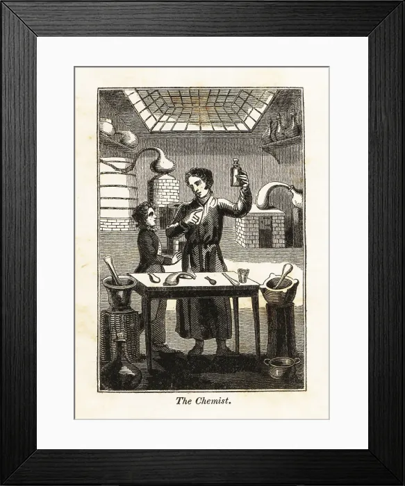 Framed Print : Chemist holding up a flask at a table in a laboratory Framed Print : Chemist holding up a flask at a table in a laboratory
