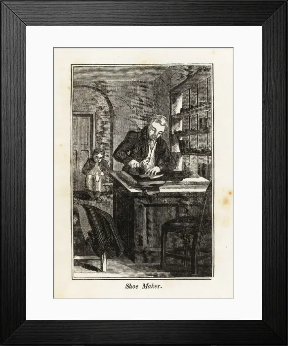 Framed Print : Shoe-maker cutting leather at a table in a shop Framed Print : Shoe-maker cutting leather at a table in a shop
