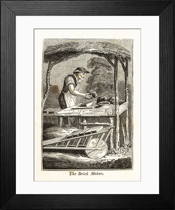 Framed Print : Brickmaker shaping clay bricks in a mold next to a kiln Framed Print : Brickmaker shaping clay bricks in a mold next to a kiln